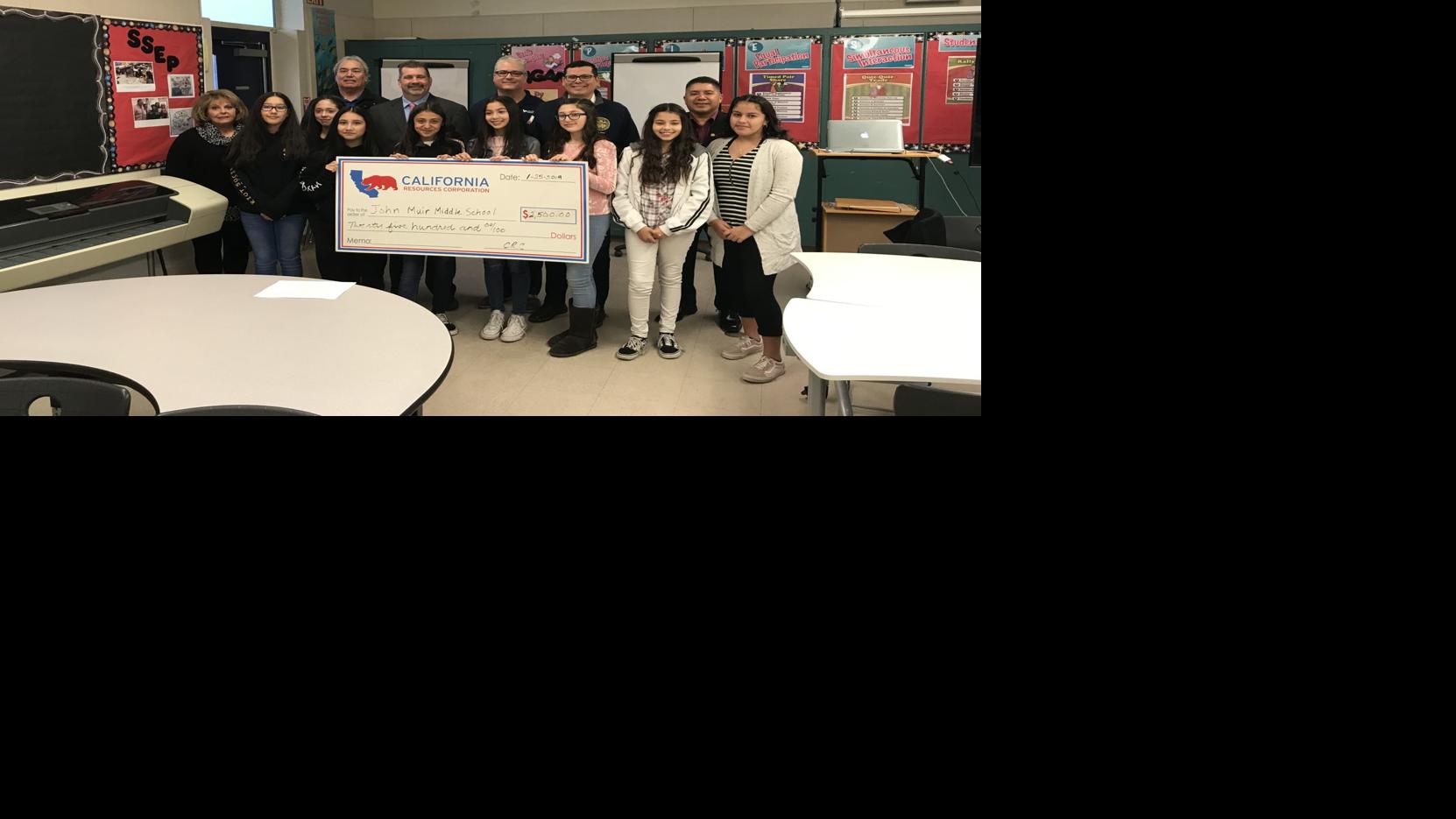 Salas presents check to John Muir Middle School Local News