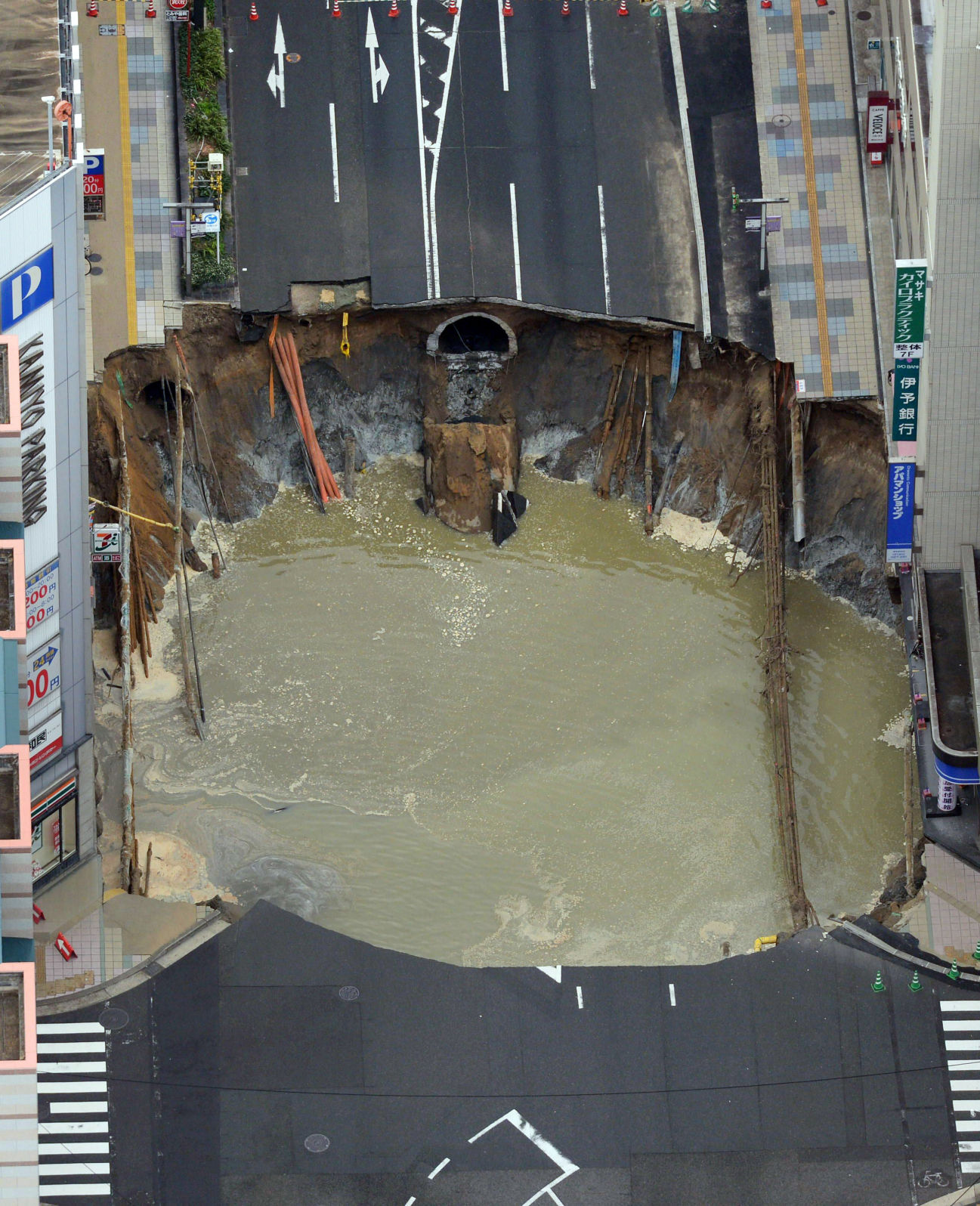 Photos: Massive sinkhole swallows street in Japan