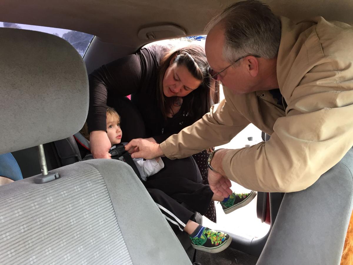 Car seat checkup helps dozens of children Local