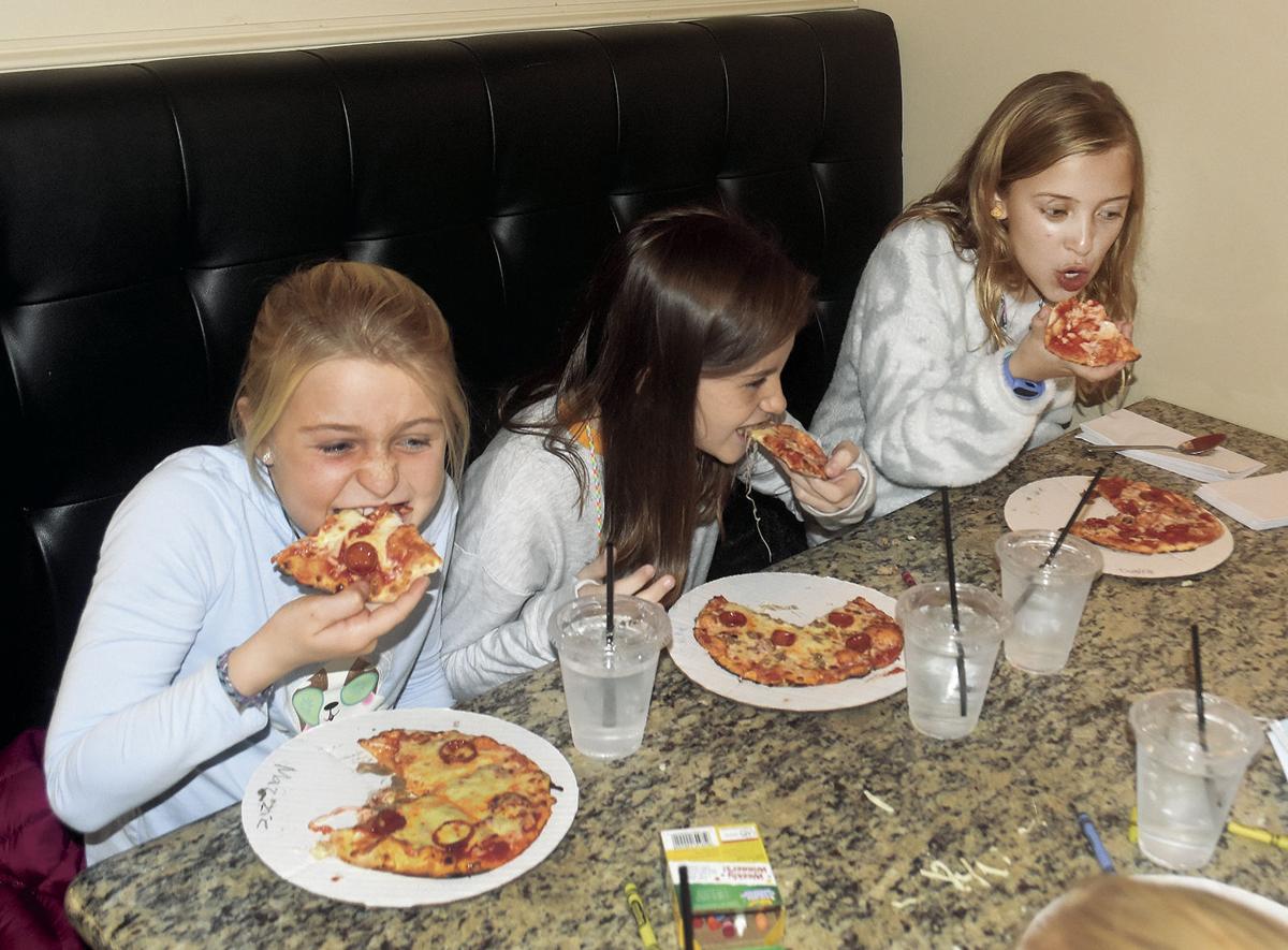 11 25 Pizza 1 Party trio eat.jpg
