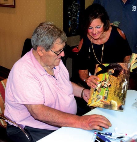 Sharyn McLain, wife of Detroit Tigers star pitcher Denny McLain, sits with  their three-year-old daughter Kristi as she looks at an album featuring a  recording of her husband's organ music with the Denny McLain Quartet, in  Detroit, Mich., on September 1