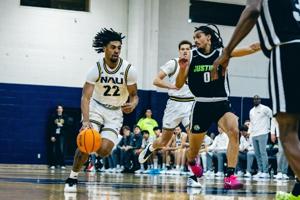 NAU ROUNDUP: Men's basketball wins first game of season against Justice University