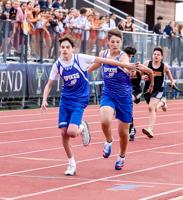 Spikes take top spot at home track meet
