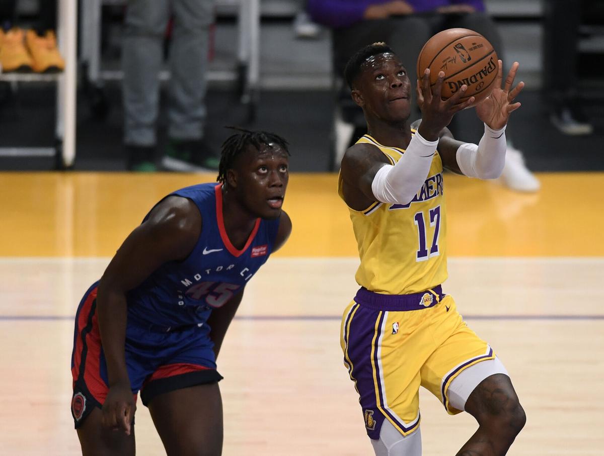 Dennis Schroder of the Los Angeles Lakers scores in front of Sekou Doumbouya of the Detroit Pistons during the first half on Saturday, February 6, 2021 at Staples Center in Los Angeles, California.