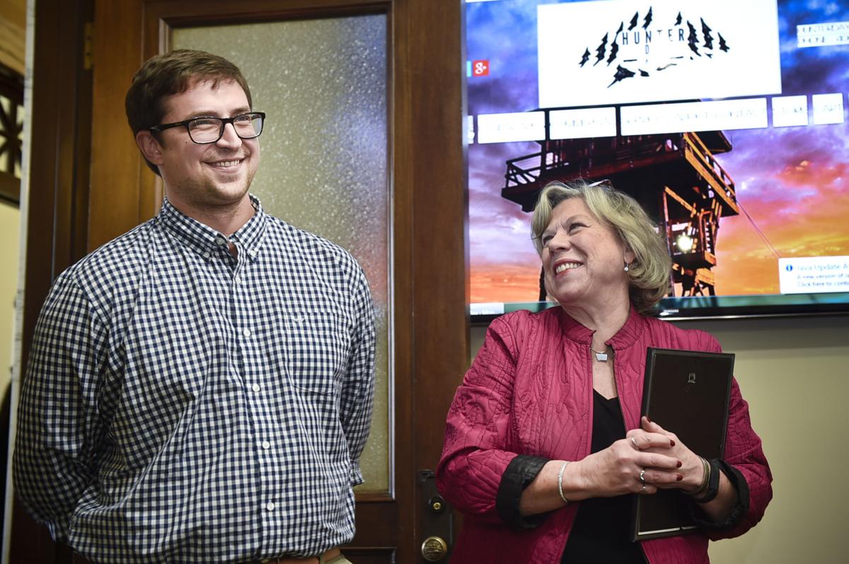 Hunter Day, left, and Secretary of State Linda McCullouch, right,