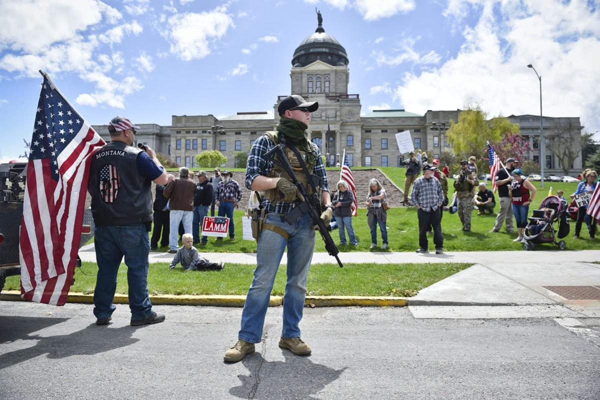 Protesters gather outside the Montana State Capitol Wednesday criticizing Gov. Steve Bullock's response to the COVID-19 pandemic.