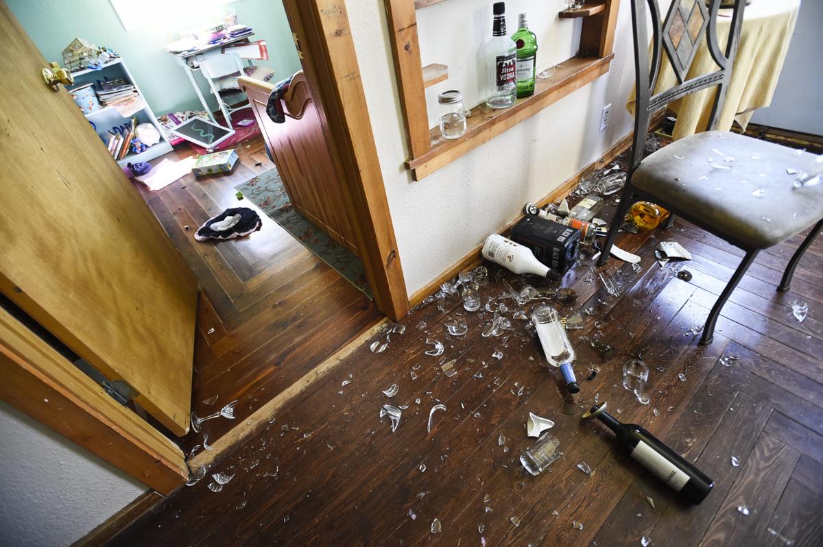Bottles and antique glassware lay broken throughout Gordon Becker home east of Lincoln Thursday morning.