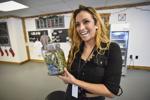 Rochelle Porter holds up a jar of marijuana buds
