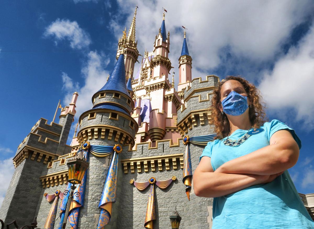 Disney senior project manager Elaine Schomburg-LaFleur at Cinderella Castle, adorned with the first decorations being installed for the Magic Kingdom's 50th Anniversary celebration later this year, at Walt Disney World, Lake Buena Vista, Fla., March 19, 2021.