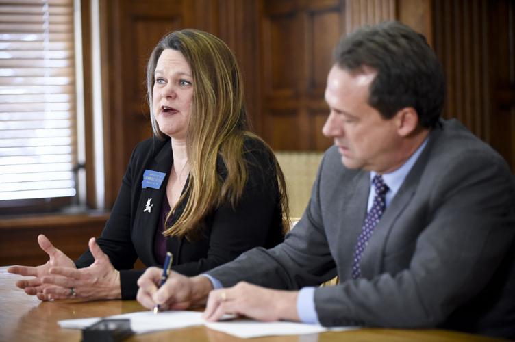 Rep. Kimberly Dudik (D-Missoula), left, discusses a package of criminal justice