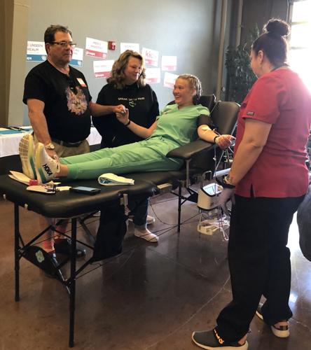 Sarah Magera's sister Heather donates blood