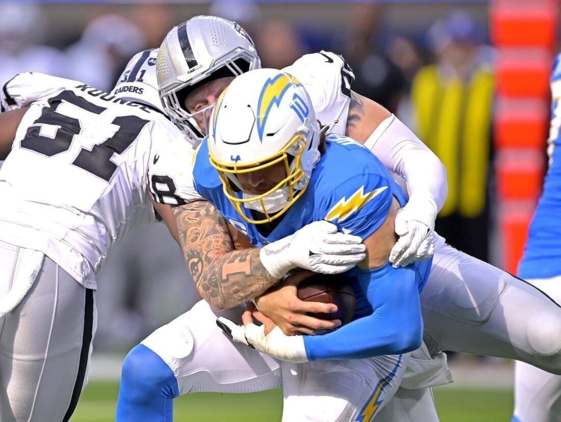 Chargers sideline clears after late hit to Justin Herbert 