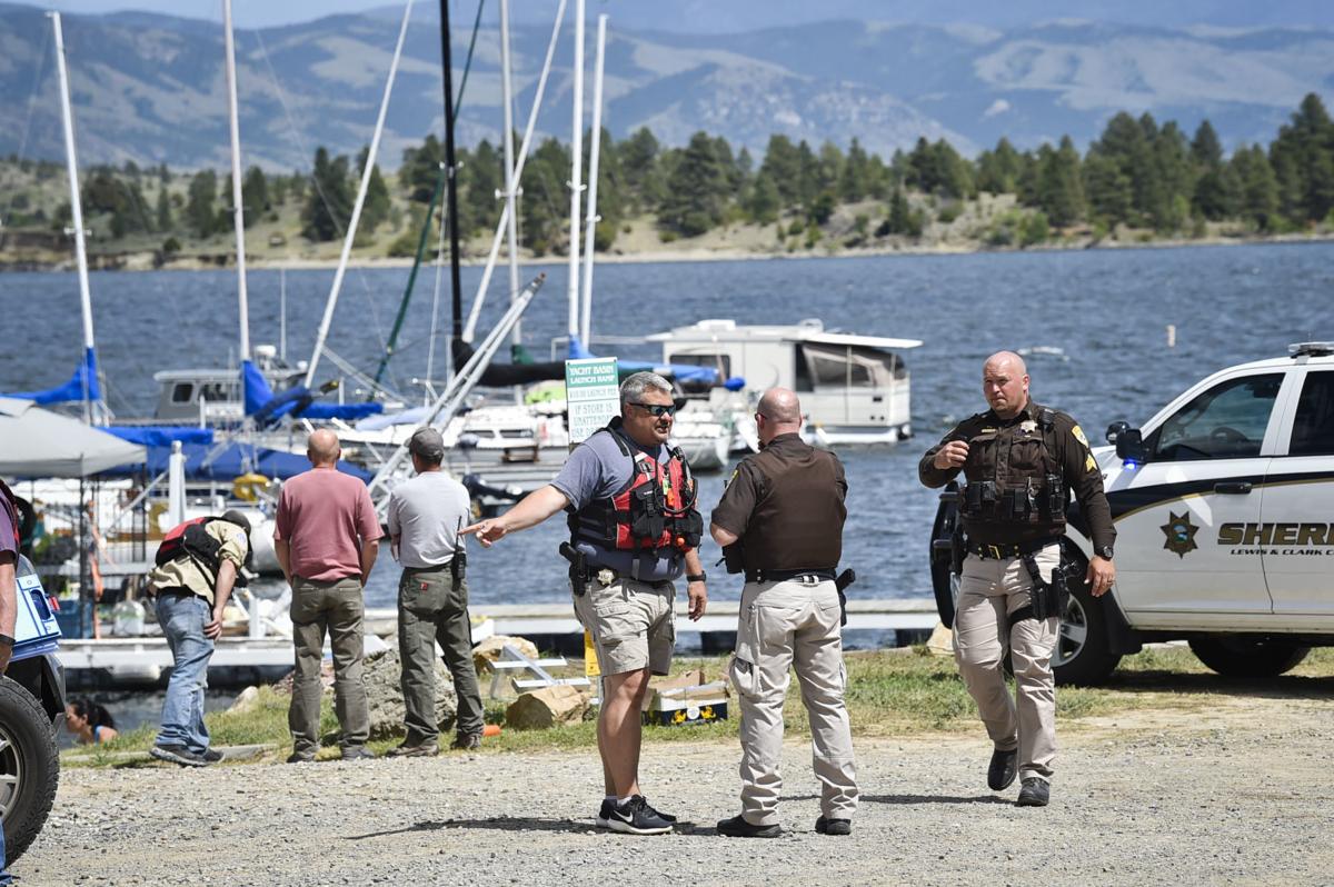 Emergency responders stage at the Yacht Basin Marina