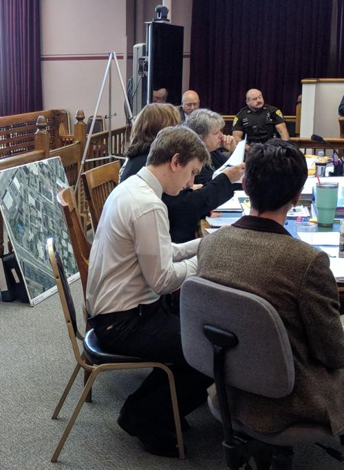 Skyler Schneider sitting at counsel's desk during his 2018 homicide trial