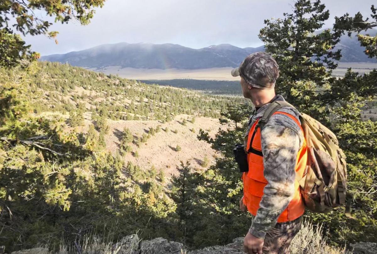 An elk hunter looks out over a vista while hunting the general season last year.