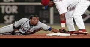 Florida Marlins' Juan Pierre scores on a Damion Easley base hit as