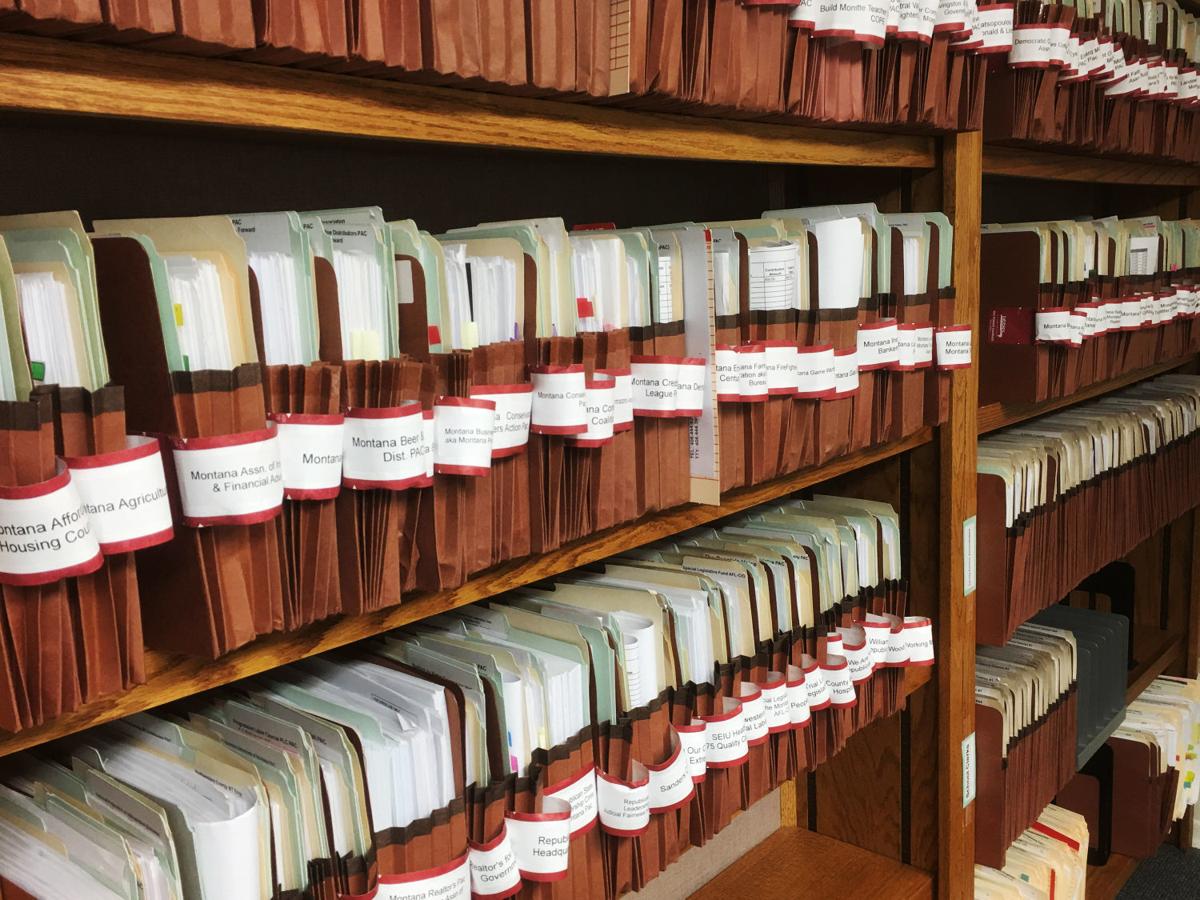 Files line a wall in the basement