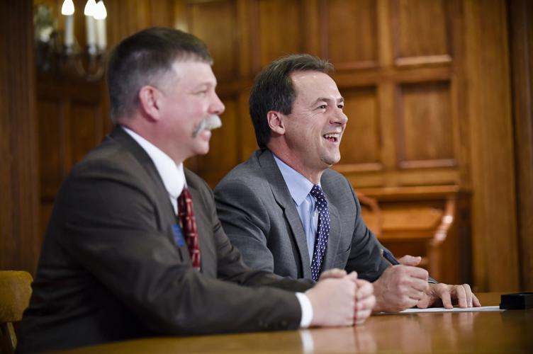 Rep. Alan Doane (R-Bloomfield), left, and Gov. Steve Bullock laugh