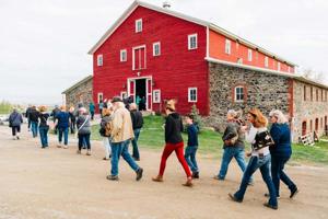 Barn with people walking in front.jpg