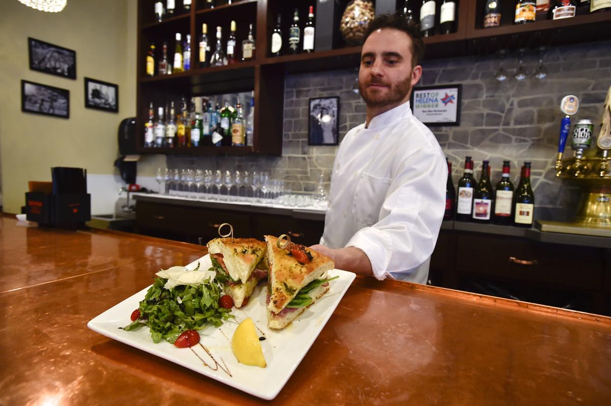 Chef and proprietor Davide Giulliani tables a panini