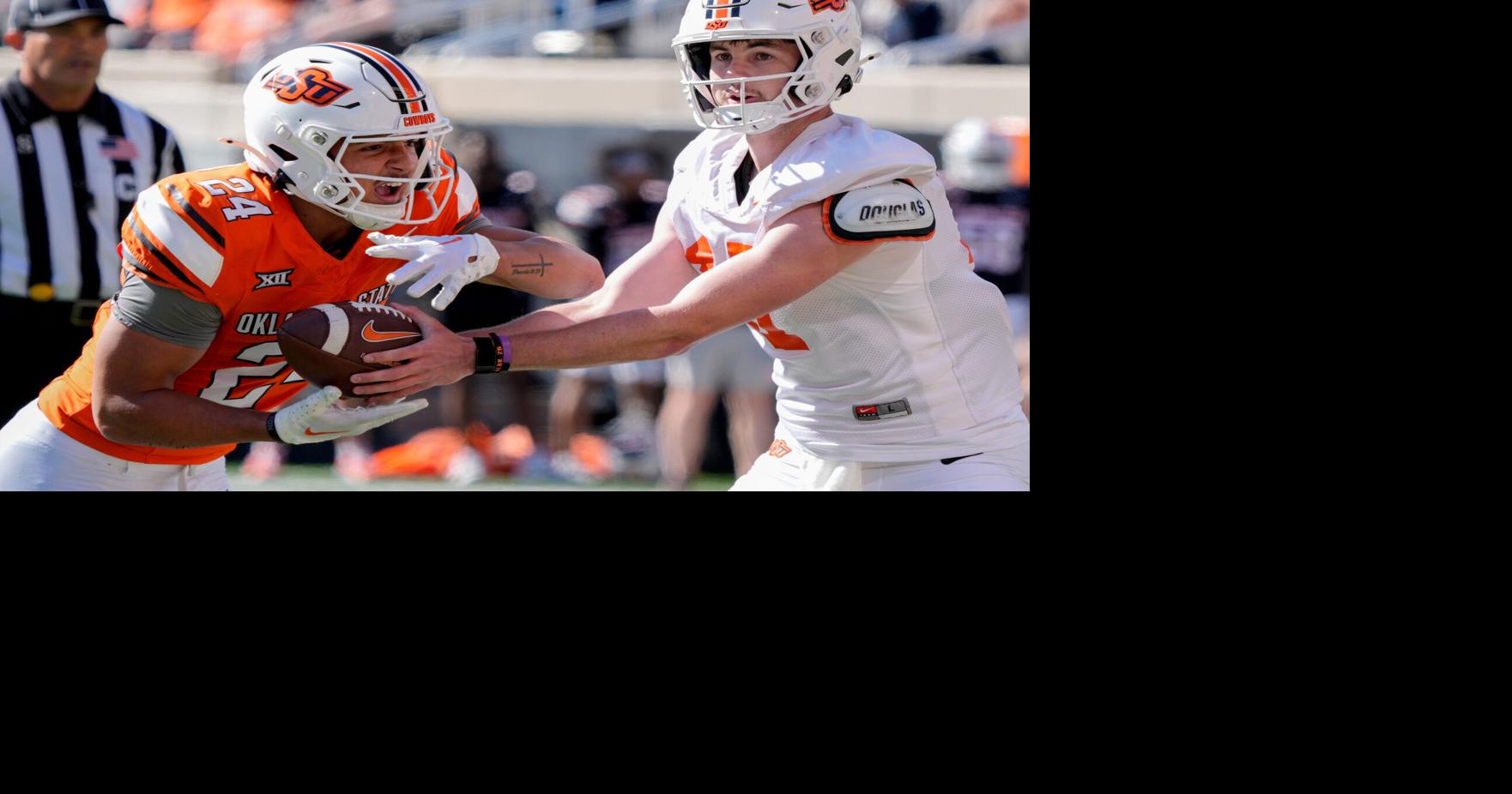 Oklahoma State's Drew Mestemaker hands off to Caleb Hawkins for a touchdown during a spring football game for the Oklahoma State University Cowboys at Boone Pickens Stadium in Stillwater, Okla., Saturday, April 18, 2026.