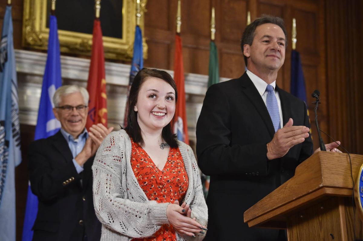 Bella Nyman, center, is honored by Gov. Steve Bullock,