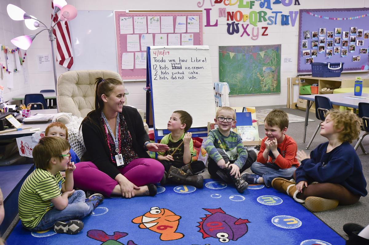 Pre-K teacher Kate Johnson holds a story sharing session