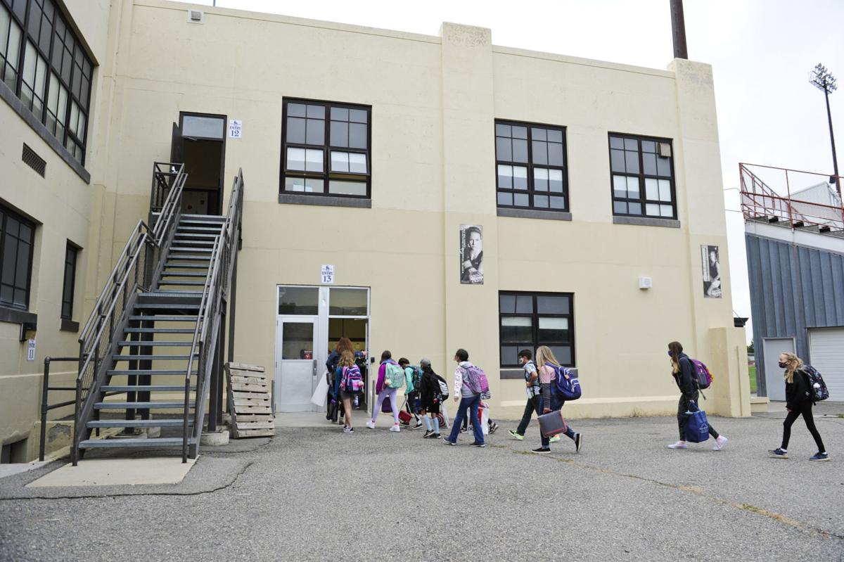 Helena Middle School sixth grade students trickle into the building Monday morning