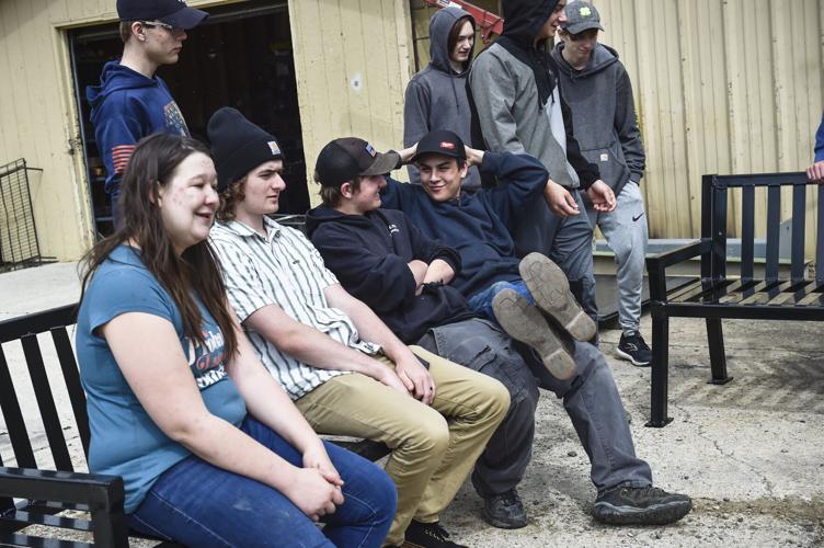 Capital High students from Tom Kain's welding class test out the benches t