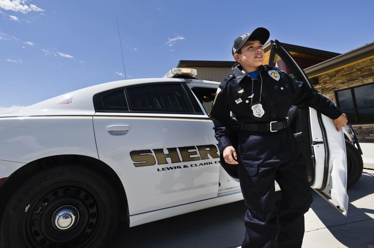 Jacob Hartford-Corpron, 11, steps out of a sheriff's vehicle Friday