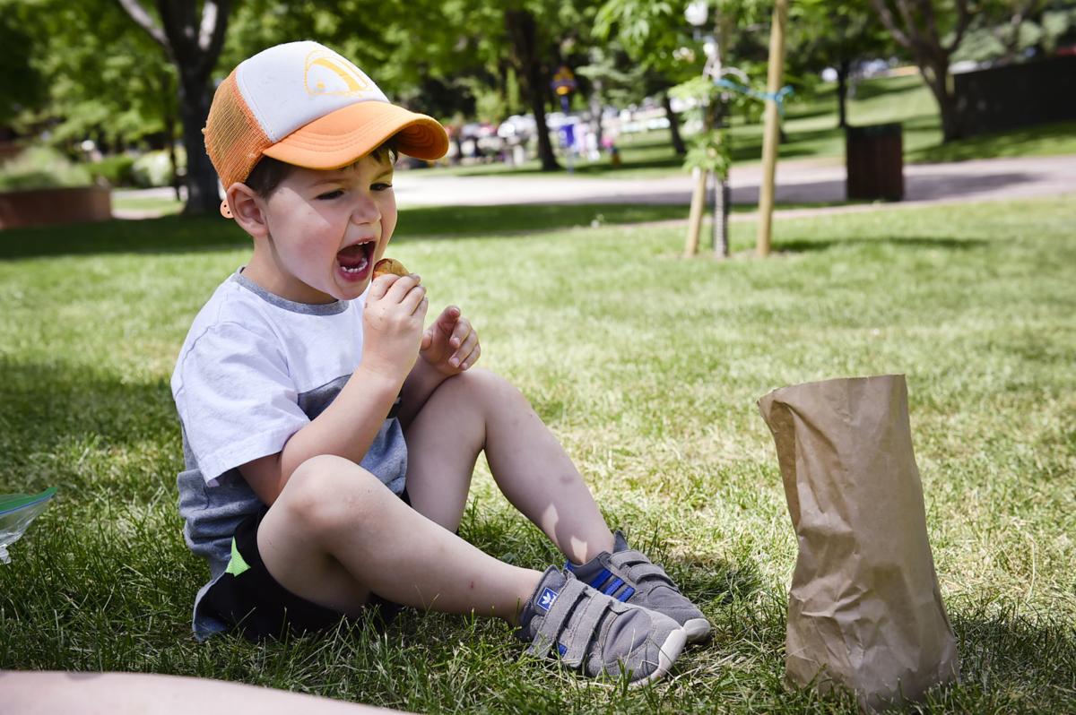 Bret Wilder munches on a mini-corndog at Anchor Park