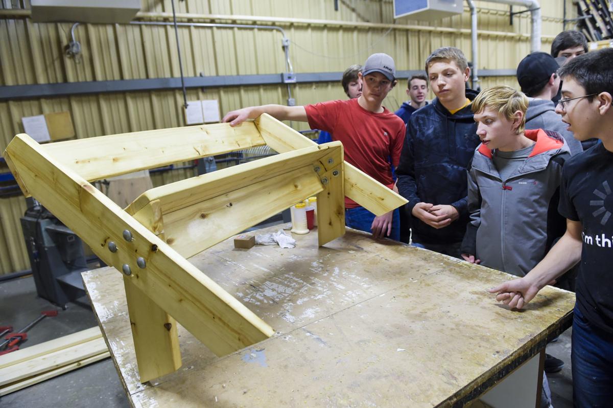 Helena High woodworking students look over their work Thursday morning