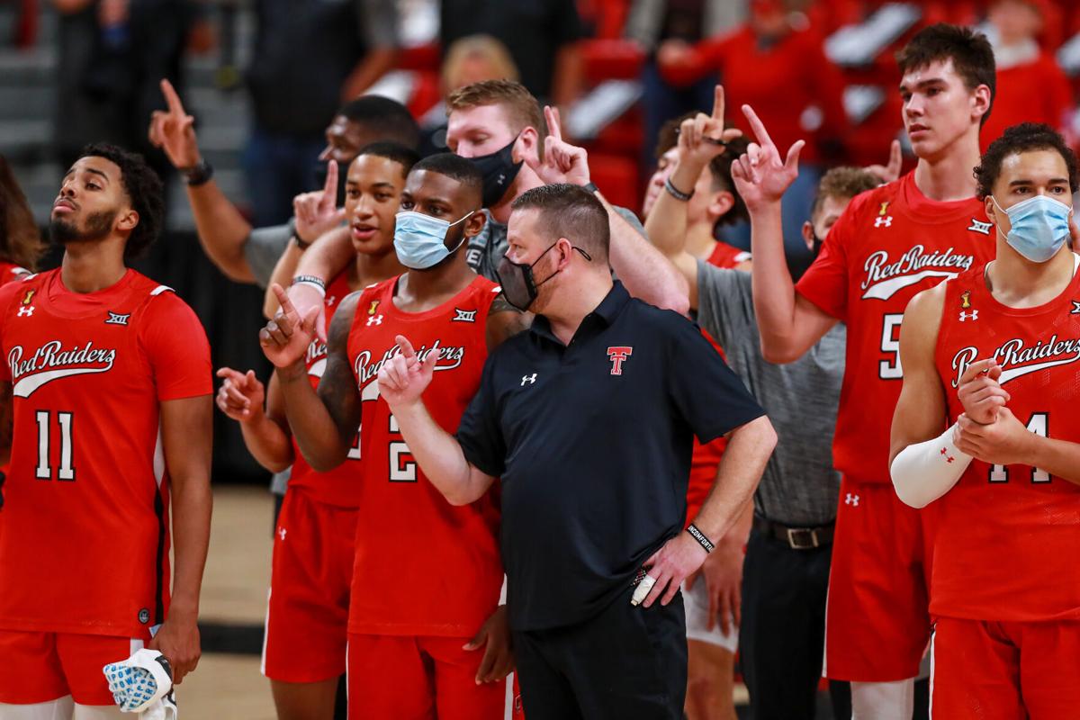 On December 6, 2020, Texas Tech guards Kyler Edwards and Jamarius Burton, head coach Chris Beard, center Vladislav Goldin and forward Marcus Santos-Silva and the rest of the Red Raiders stand for The Matador Song after a game against Grambling State at United Supermarkets Arena in Lubbock, Texas.