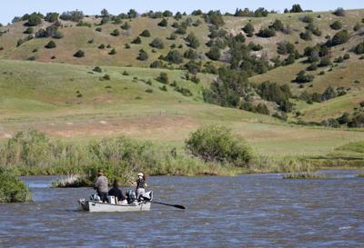 Anglers drift down the Madison River