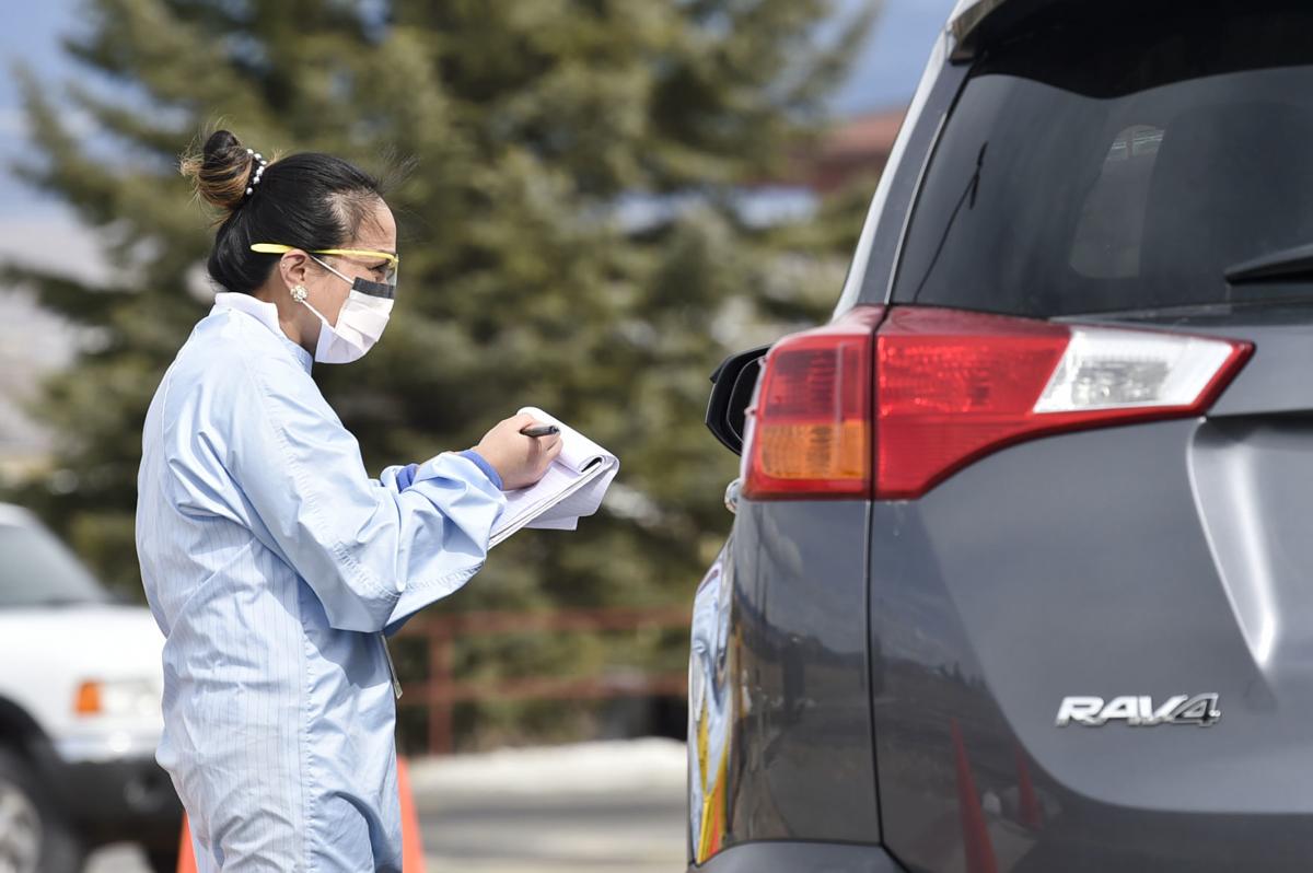 A healthcare worker tests a patient for Covid-19