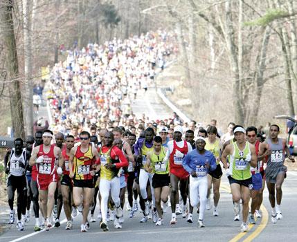 Cheruiyot stands tall to defend Boston Marathon title