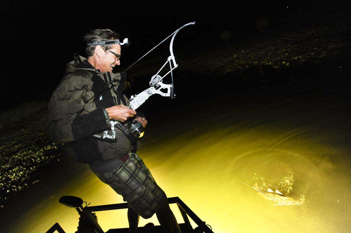 Bowfishing carp at night 'It's a cool rush' Local