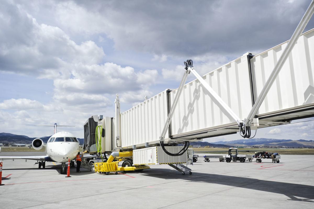 A Delta Airlines planes sits parked at the new jet bridge