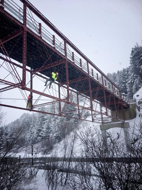 Climbing inspectors complete a full inspection of the Dearborn River High Bridge on Dec. 20 in preparation for rail and deck repairs this week.
