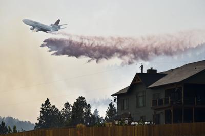 A Vlat Or Very Large Air Tanker Drops A Load Of Retardant On A A Vlat Or Very Large Air Tanker Drops A Load Of Retardant On A