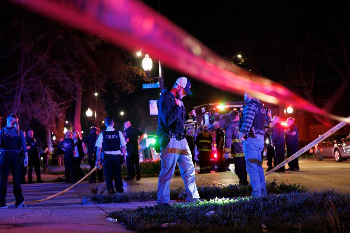 Officers and paramedics work the scene where multiple people were shot near the 5200 block of South Damen Avenue, April 13, 2024, in Chicago.
