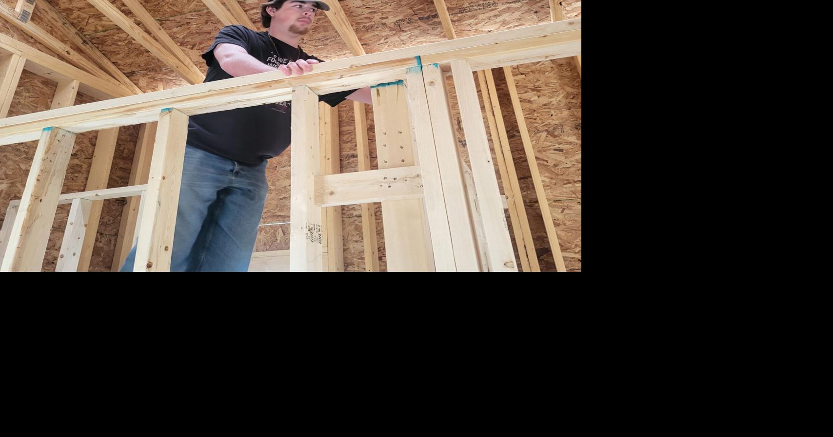 Charleston High School students gain big experience building tiny houses