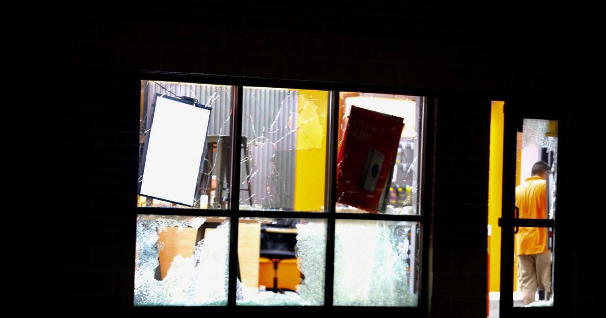 Police respond to damage at Boost Mobile in Decatur