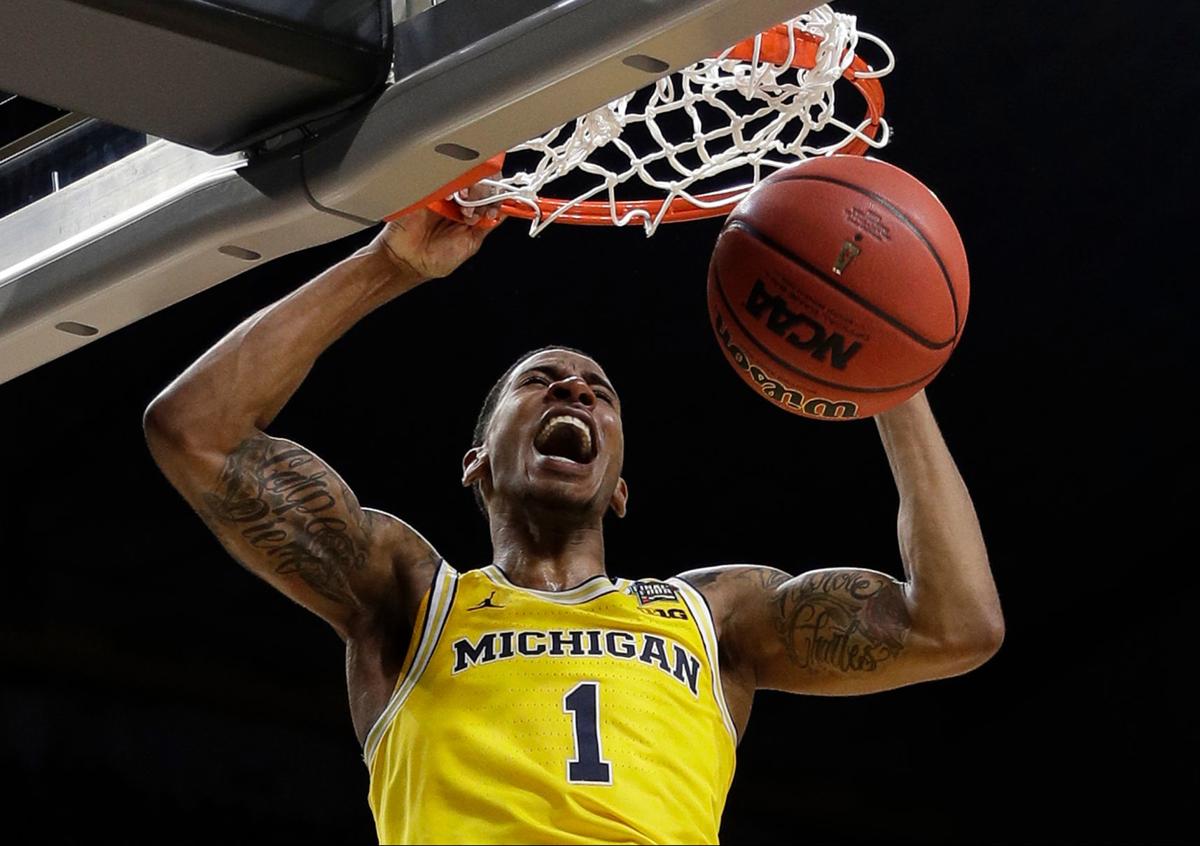 Distinctly Different Michigan Villanova As Opposite As Coaches Basketball Herald Review Com