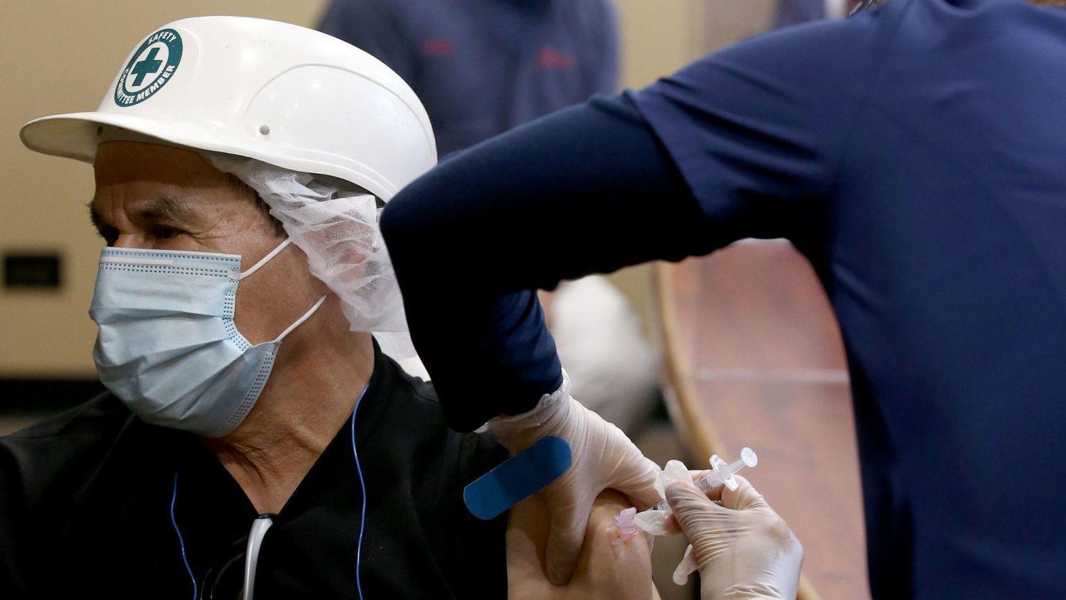 Flu shots at work are routine, but company COVID vaccine clinics are hard to come by. That might be changing. - Vimarsana News