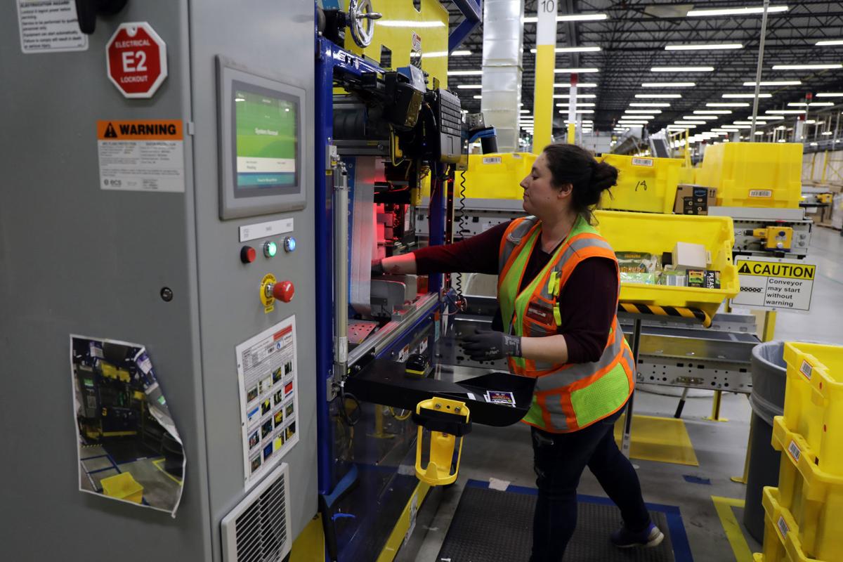 Robots work alongside humans in Illinois Amazon warehouse for the first