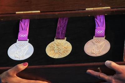 Here's a look at every Olympic gold medal design since ...