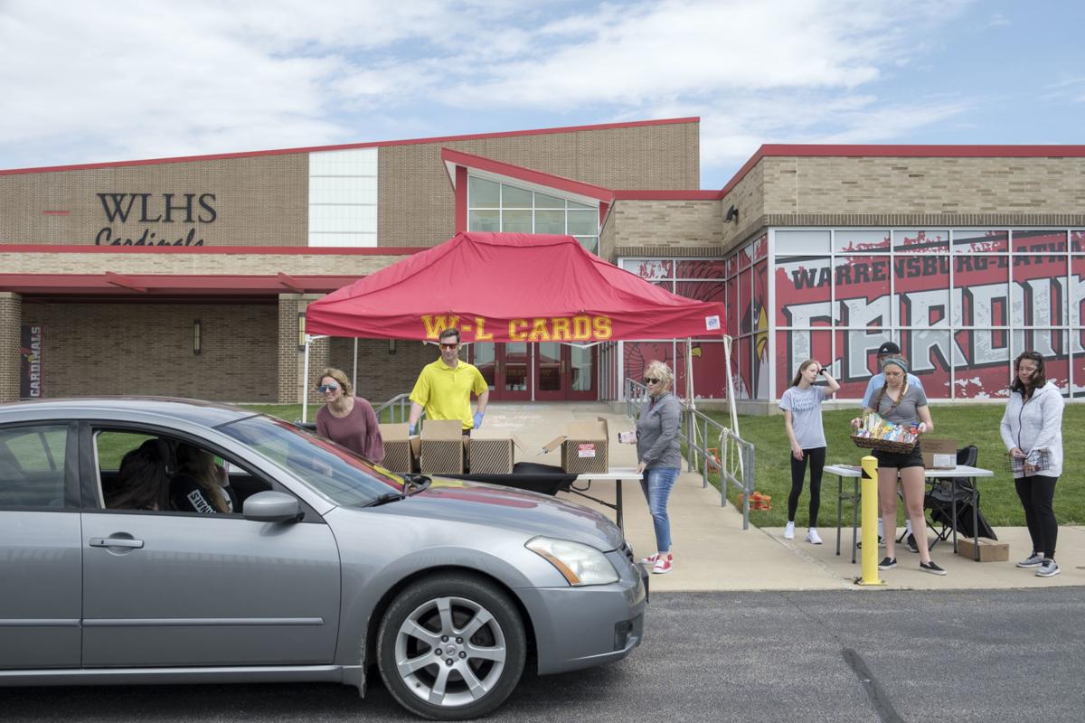 Staff celebrate WarrensburgLatham seniors during drivethrough