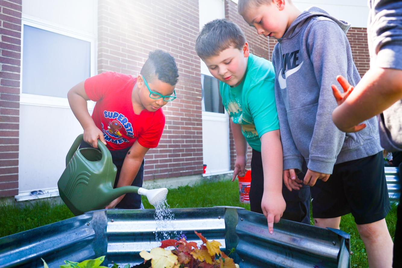 WarrensburgLatham students work the dirt for Earth Day