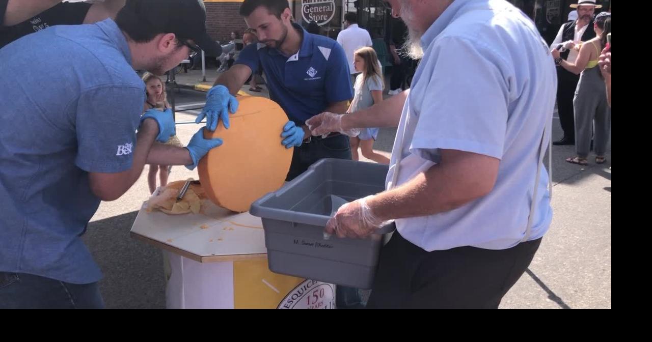 Cutting cheese at Arthur Cheese Fest